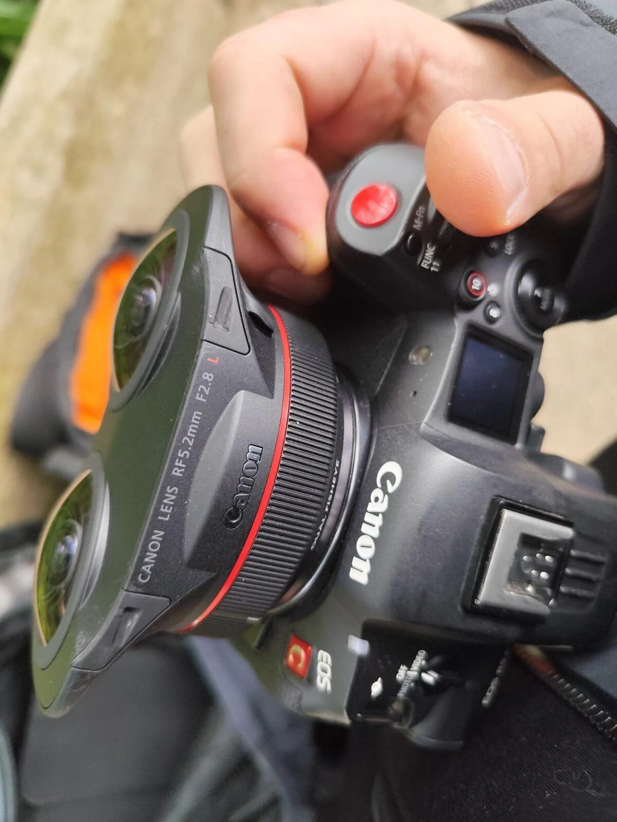 Close-up of a Canon camera and lens being held during capture for Discover London.