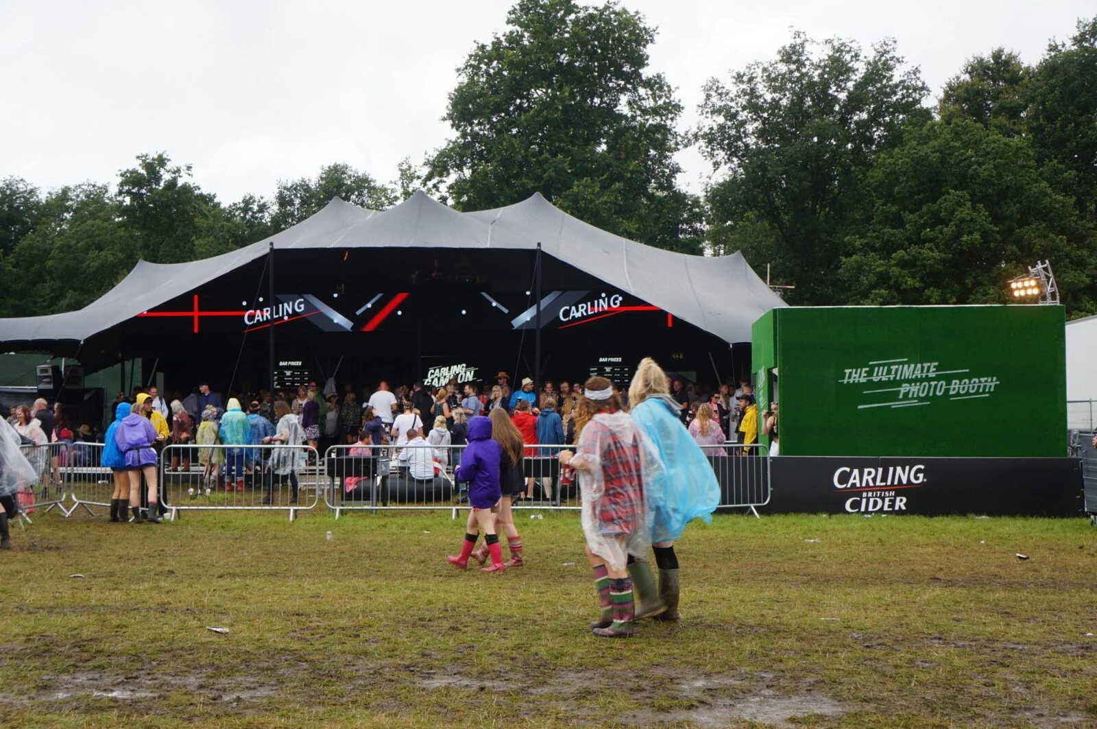 Carling festival tent with an outdoor crowd and green cider branding.
