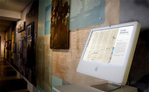 Codex Sinaiticus interactive display on a white computer in a museum gallery.