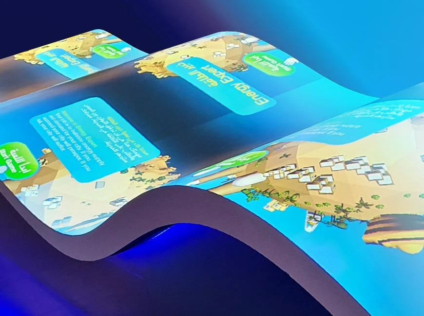 Curved Energy Manager table displaying colourful islands and game instructions.