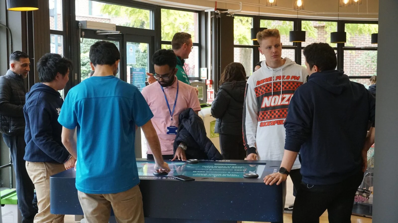 Participants playing together at the Find Your Path recruitment game table.