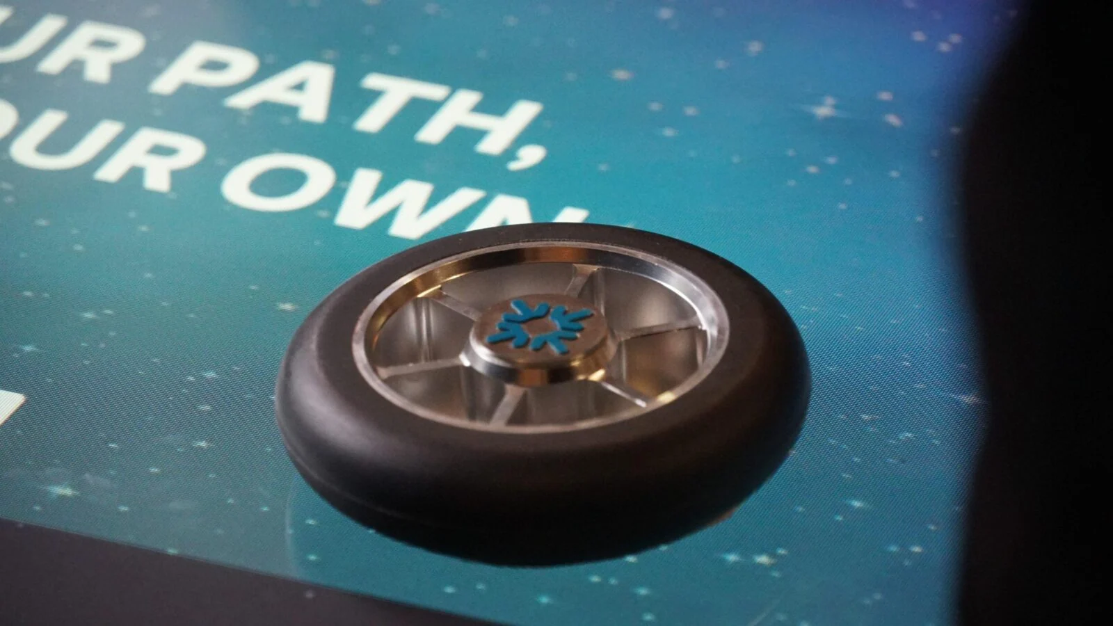 Close-up of a round physical controller on the Find Your Path interactive table.