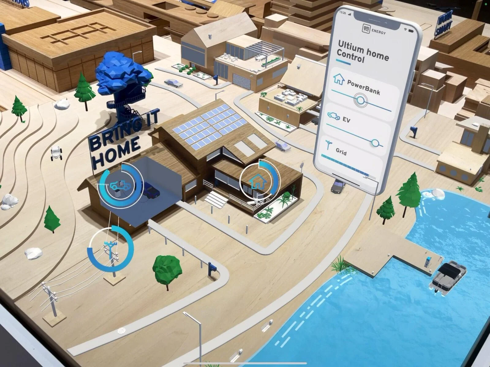 Augmented reality energy controls and a floating phone interface over the GM Energy model city.
