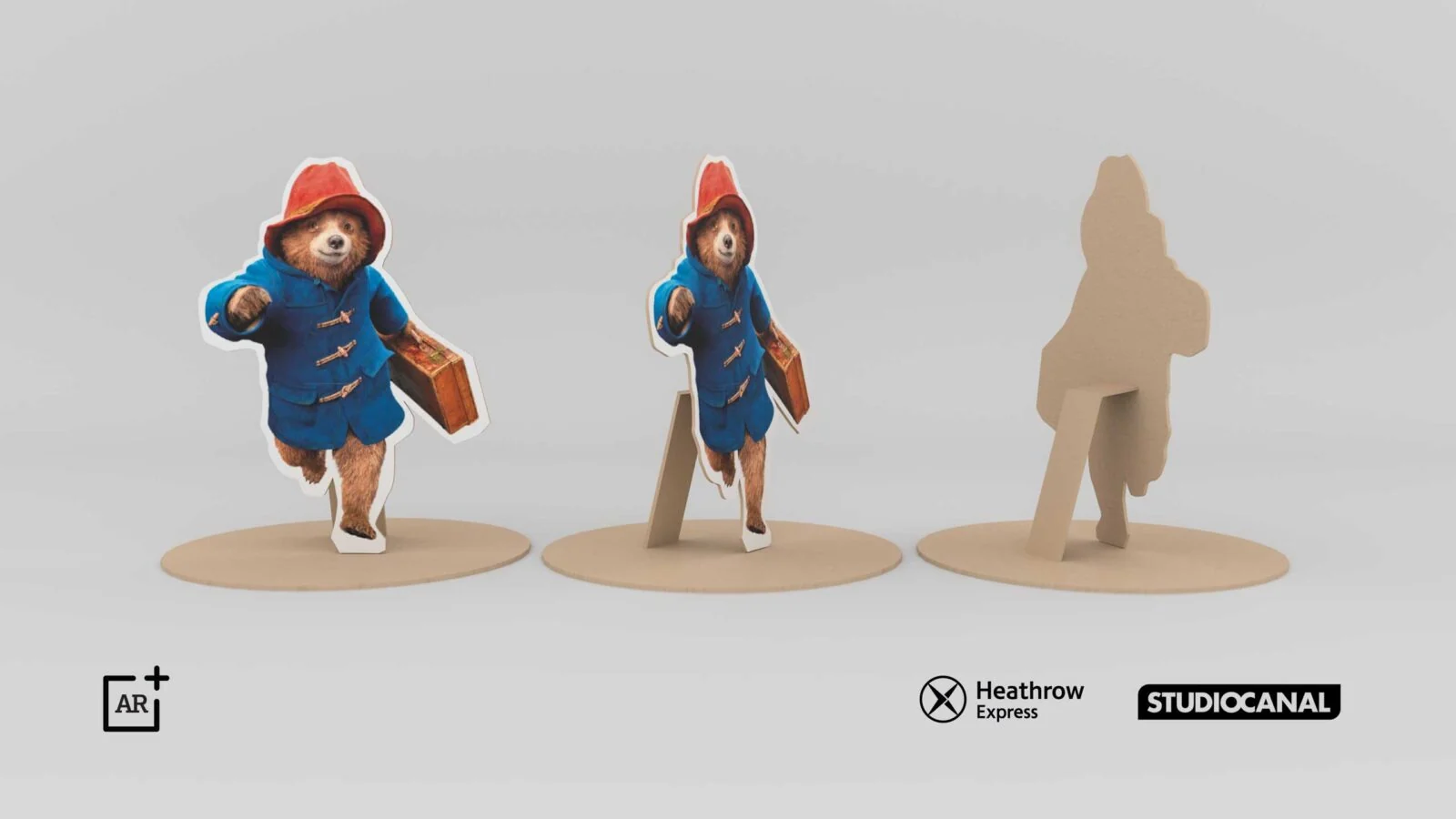 Front, side and silhouette views of a paper-style Paddington character model.