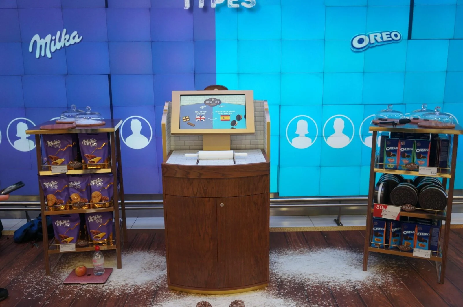Mondelez biscuit bakery touchscreen between product displays beneath Milka and Oreo branding.