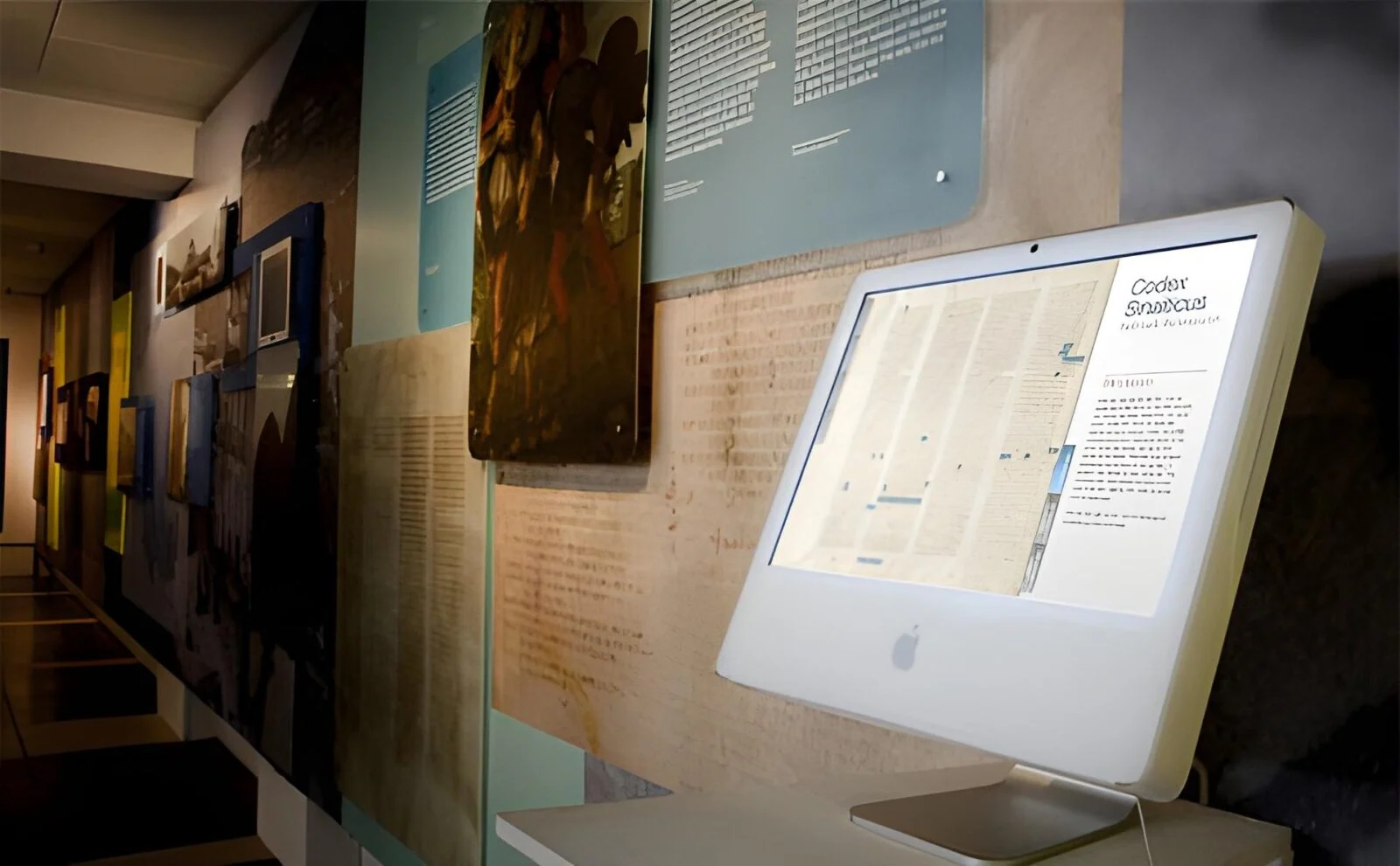 Codex Sinaiticus interactive display on a white computer in a museum gallery.