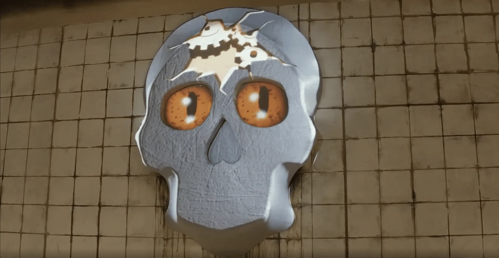 Projected cartoon skull with orange eyes and a cracked forehead on a tiled wall.