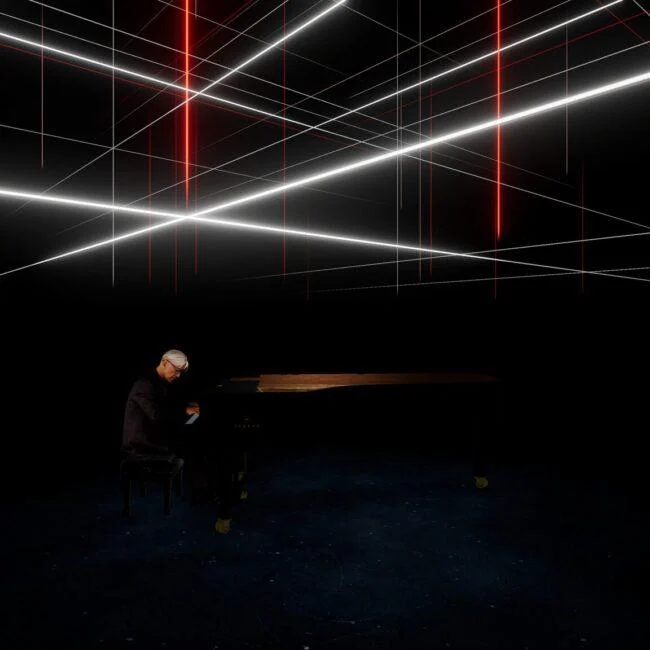 Pianist at a grand piano beneath intersecting white and red light lines in Kagami.