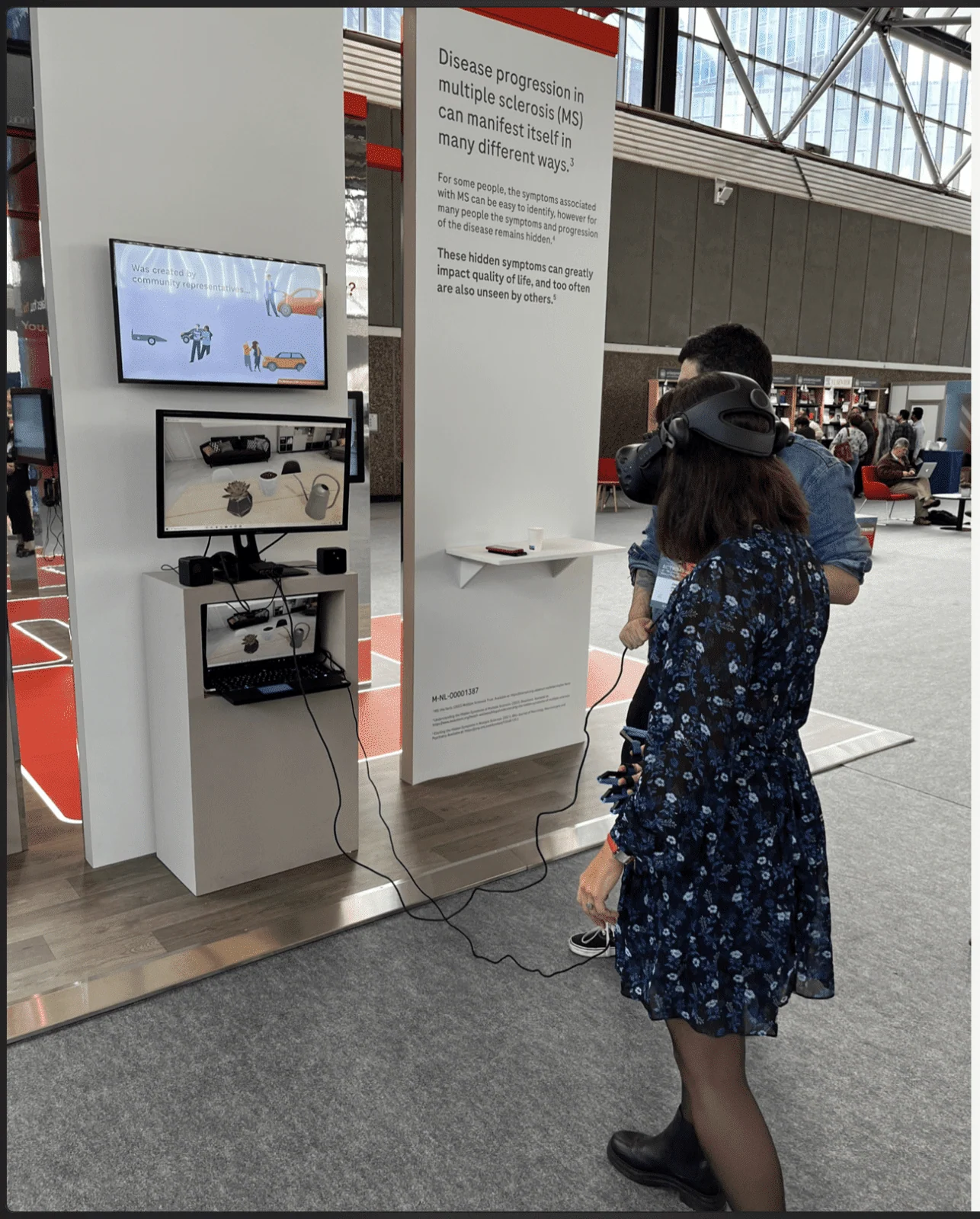 Visitor wearing a virtual reality headset at a Roche exhibition kiosk.