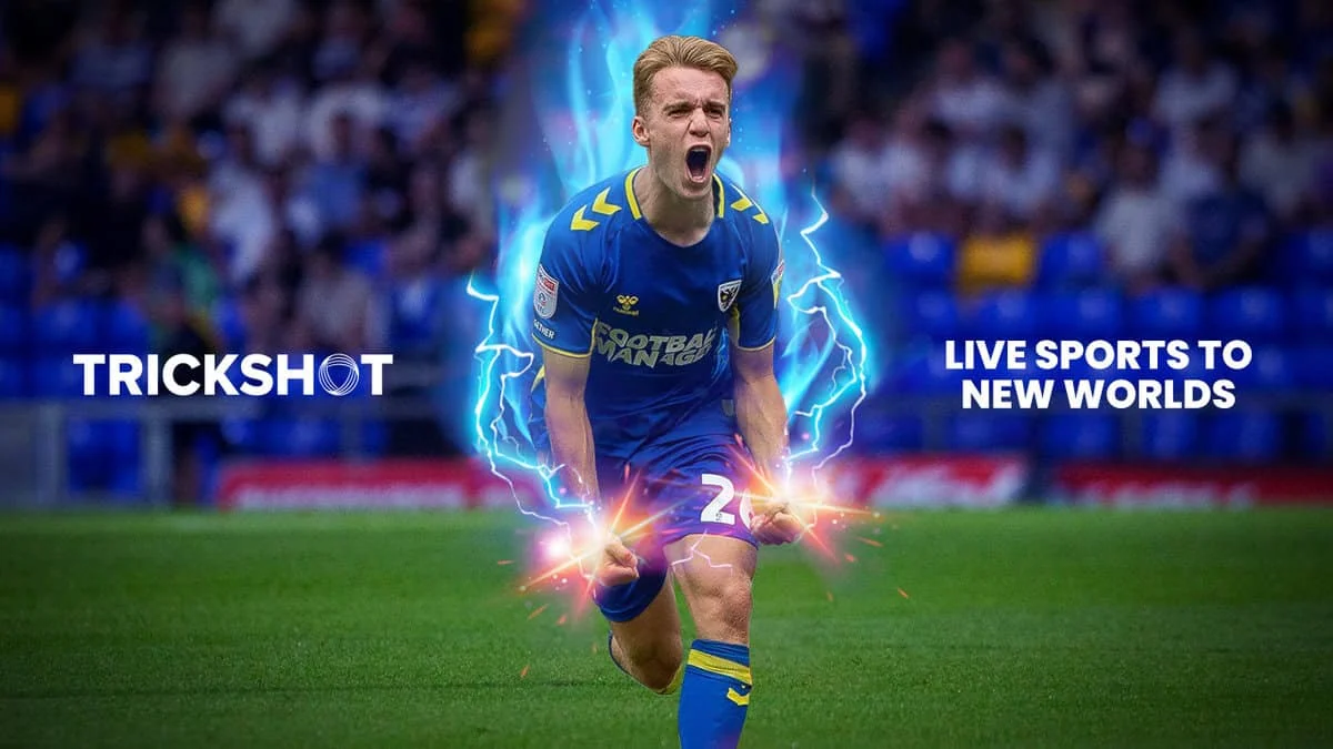Footballer surrounded by blue energy effects in a Trickshot spatial sports promotional image.