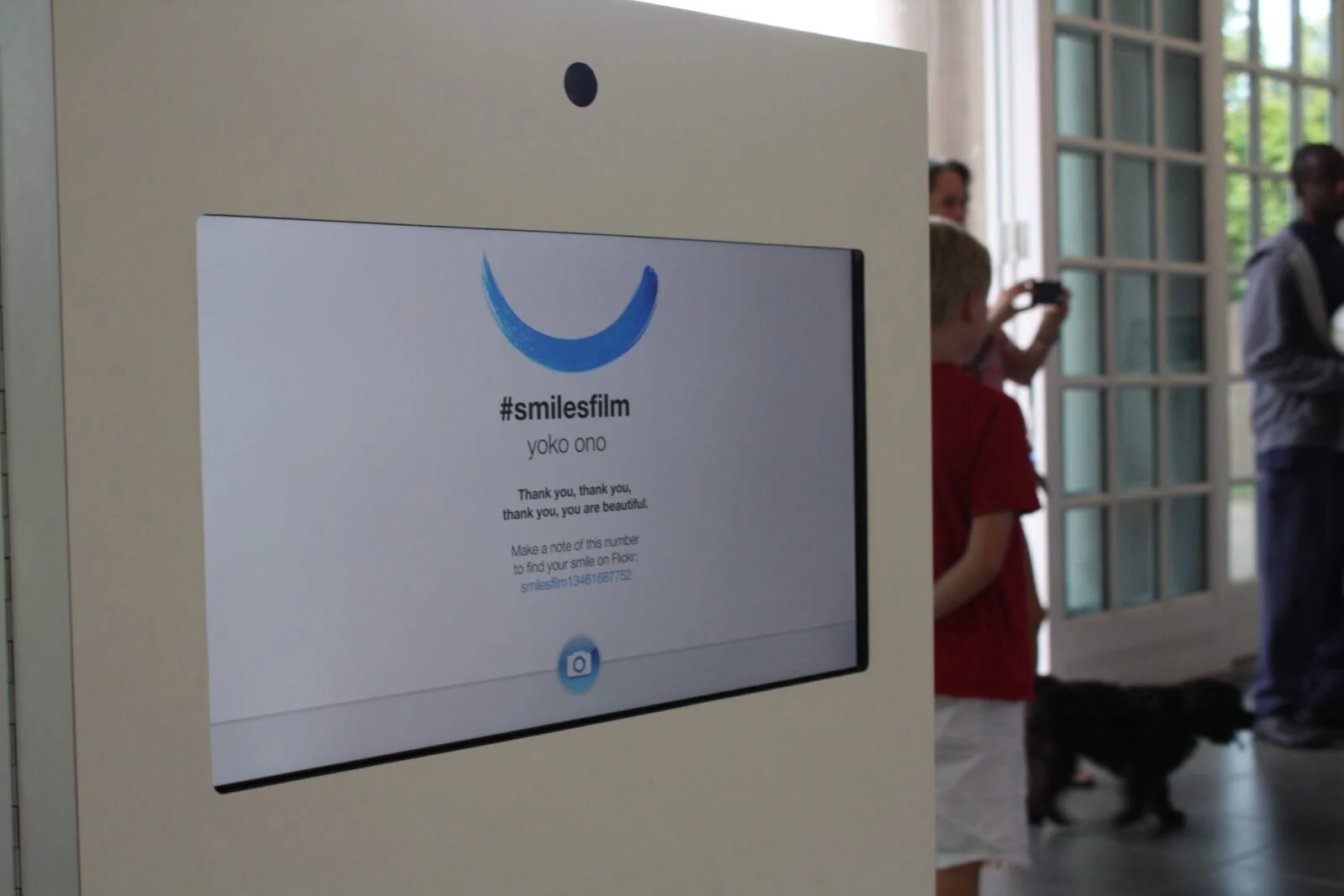 Smiles Film recording kiosk with a camera and an on-screen thank-you message.