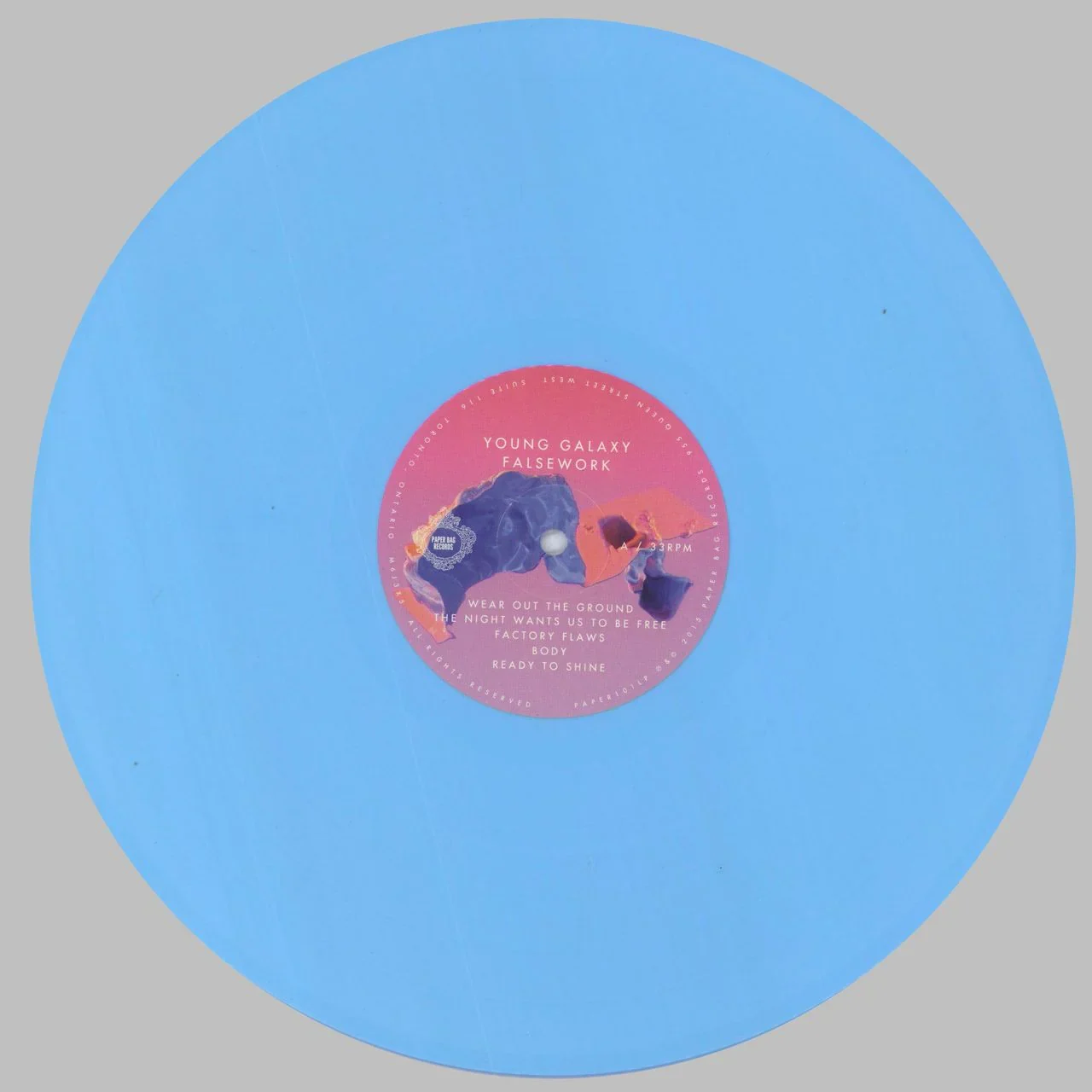 Blue vinyl record with a pink Young Galaxy label.